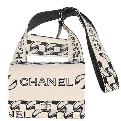 Chanel 2002-2003 Beige Black Canvas Graphic Logo Mademoiselle Lock Shoulder Bag