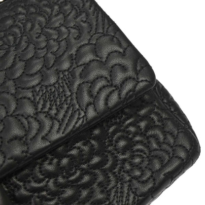 Chanel Black Camellia Embossed Lambskin Medium Classic Double Flap Bag