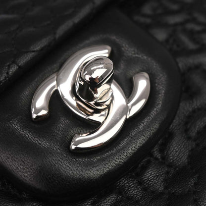 Chanel Black Camellia Embossed Lambskin Medium Classic Double Flap Bag