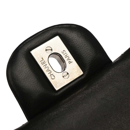 Chanel Black Camellia Embossed Lambskin Medium Classic Double Flap Bag