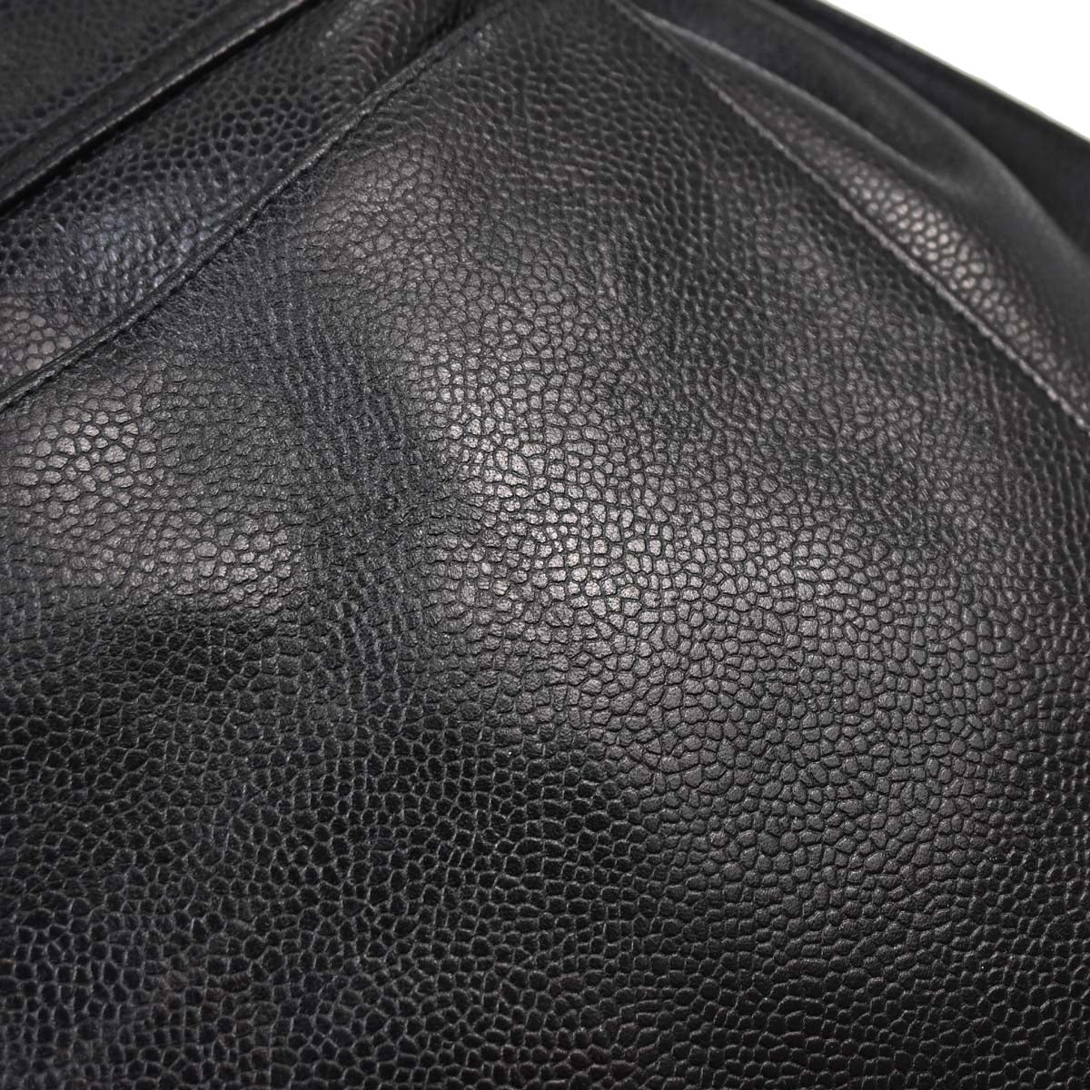 Check Chanel 1991-1994 Black Caviar Skin Triple CC Backpack