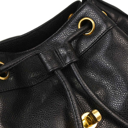 Check Chanel 1991-1994 Black Caviar Skin Triple CC Backpack