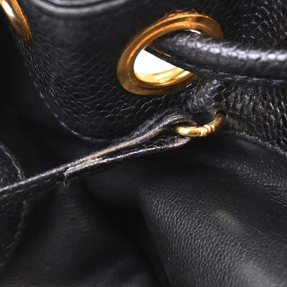 Check Chanel 1991-1994 Black Caviar Skin Triple CC Backpack