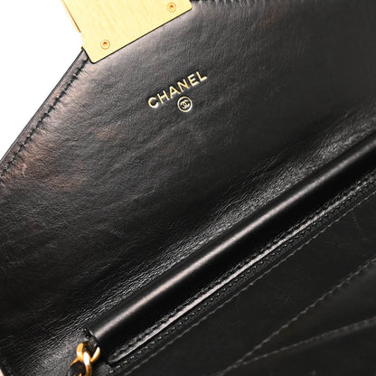 Check Chanel 2018-2019 Black Lambskin Chevron Medal Flap WOC Shoulder Wallet Bag