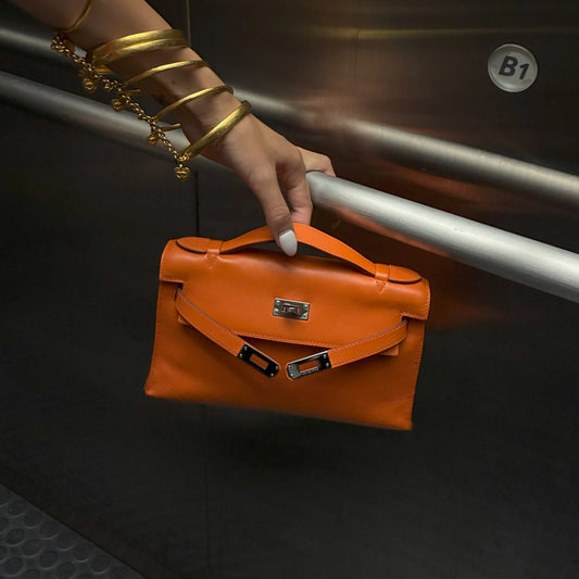 Hermes 2007 Orange Swift Kelly Pochette