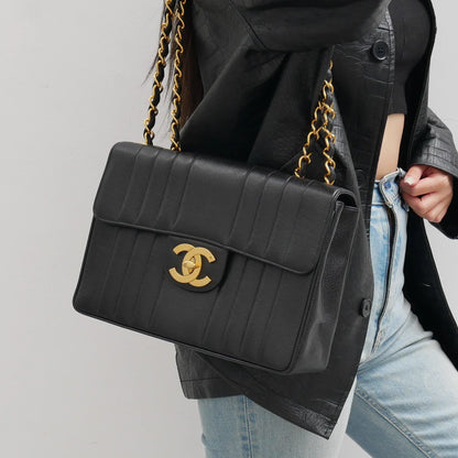 Chanel * 1994-1996 Black Caviar Jumbo Vertical Stith Classic Flap