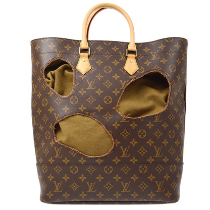 LOUIS VUITTON 2014 x Comme Des Garcons Bag with Holes M40279