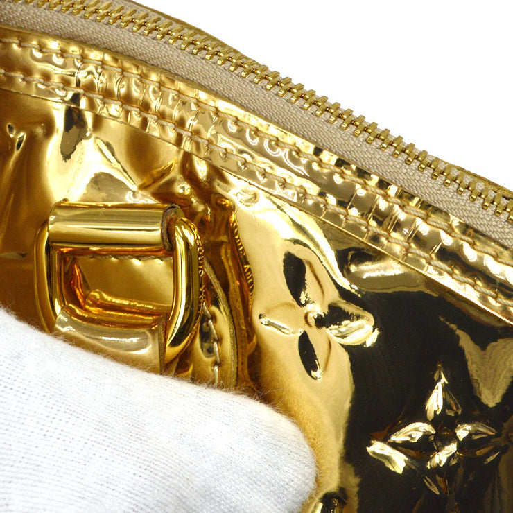 A LIMITED EDITION GOLD MONOGRAM MIROIR ALMA MM WITH GOLD HARDWARE