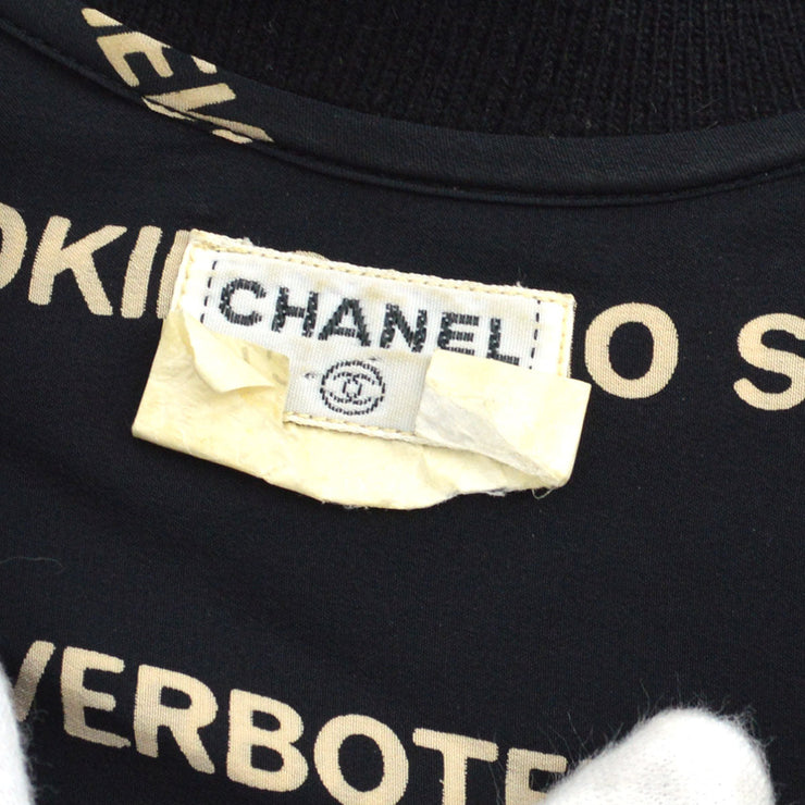 CHANEL ‘No Smoking’ silk blouse with knitted sleeves and collar