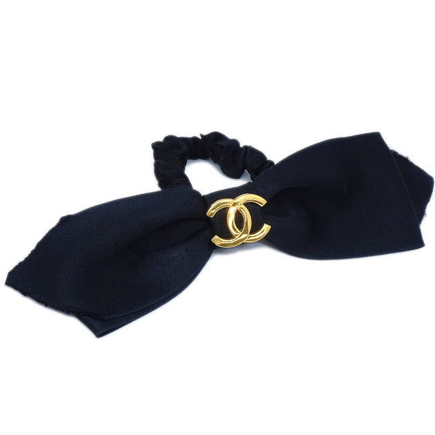 Chanel, a black silk ribbon. - Bukowskis