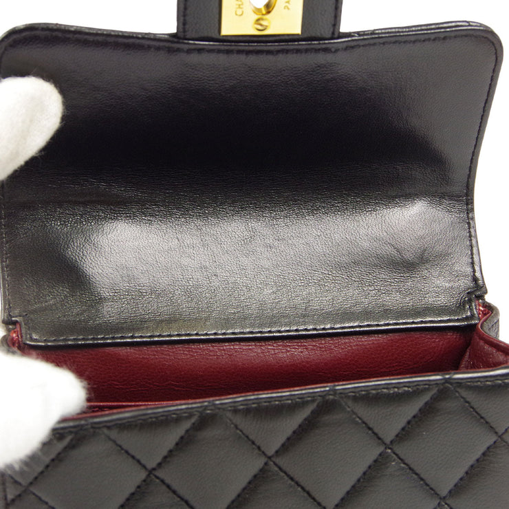 Chanel 1994 Black Lambskin Micro Classic Flap Handbag